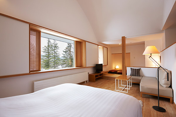 SUPERIOR ROOM (Room303) Strikingly tall arched ceiling with large window facing the mountains is sure to take your breath away.