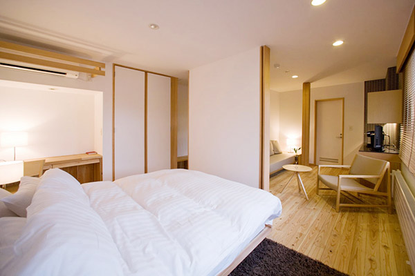 DELUXE ROOM (Room206) Room filled with gentle sunlight and soft hued interiors.